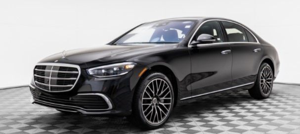 Black luxury sedan at SFO airport terminal for Bay Area airport transfer service